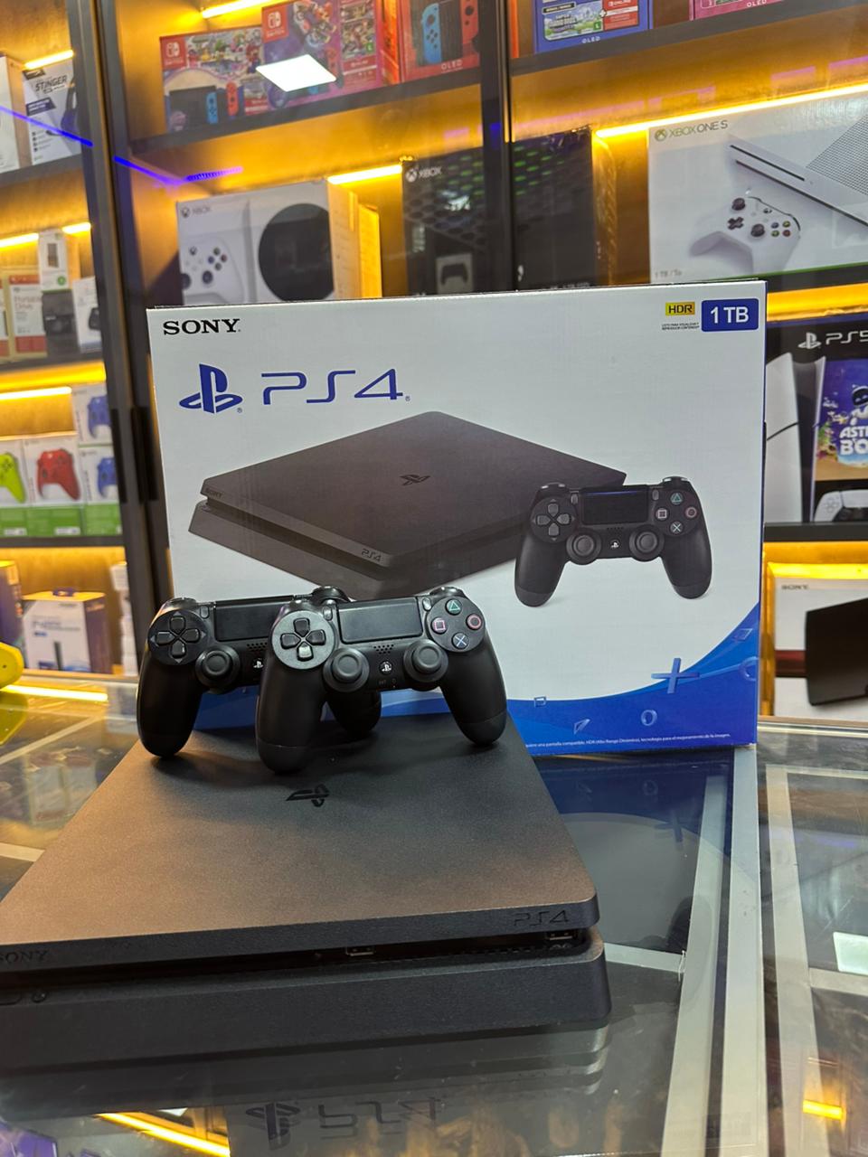 Playstation 4 slim 1tb semi novo + 2 controles + 1 jogo variavel * foto ilustrativa*